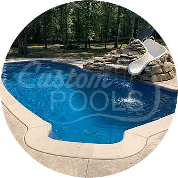 Backyard Swimming Pool with Rock Waterfall and Slide Feature